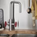 Baterie bucatarie GoodHome Kamut, 2 robineti, efect din otel inoxidabil, furtune de prindere preinstalate